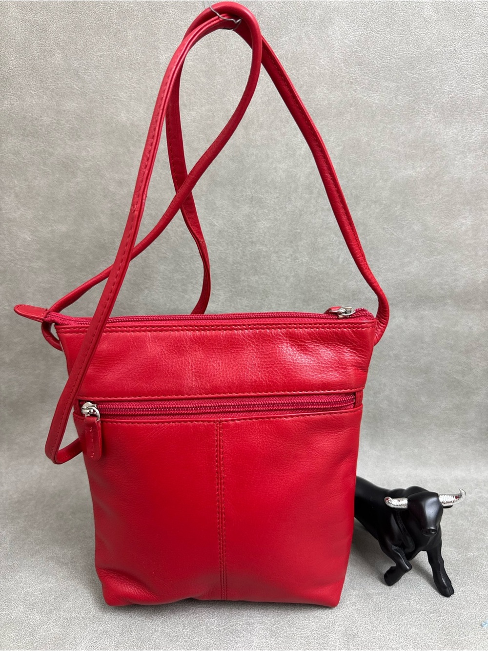 Sleek Red Leather Crossbody Bag with Front Zip Pocket